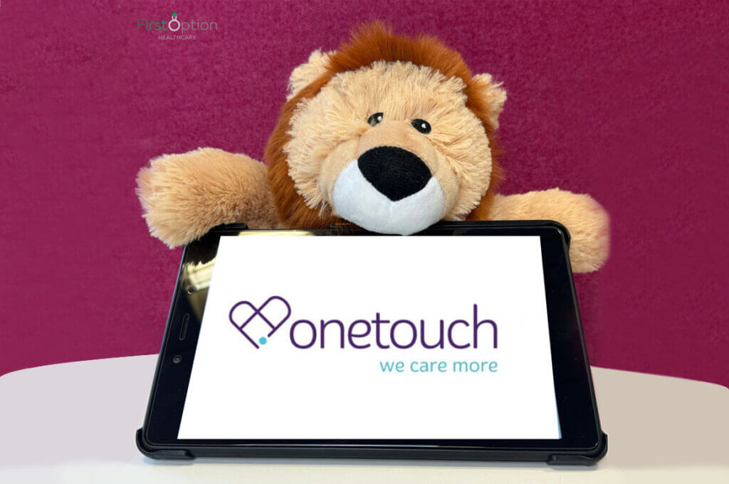 Lion teddy holding iPad with one touch logo